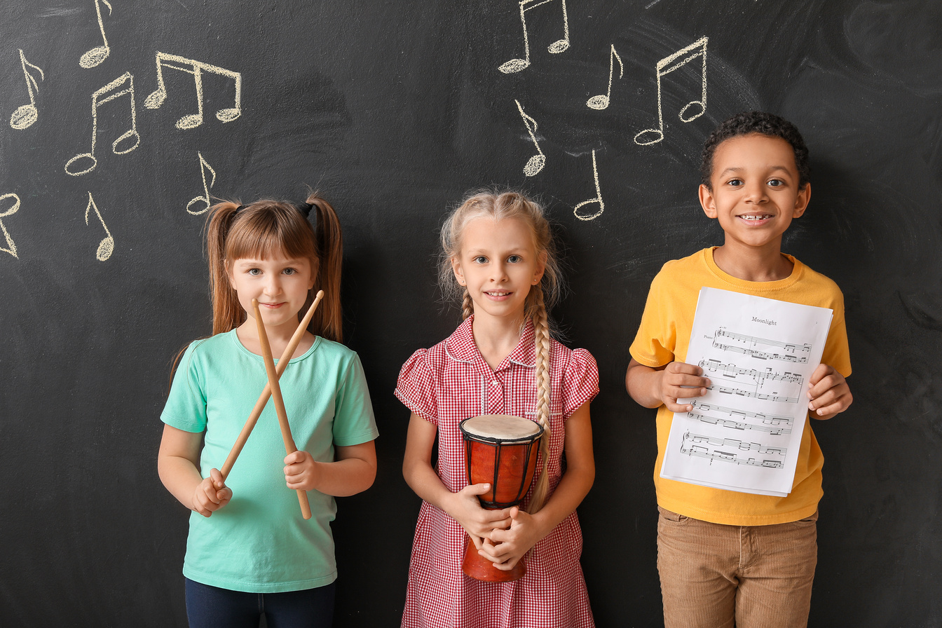 Little Children near Chalkboard at Music School